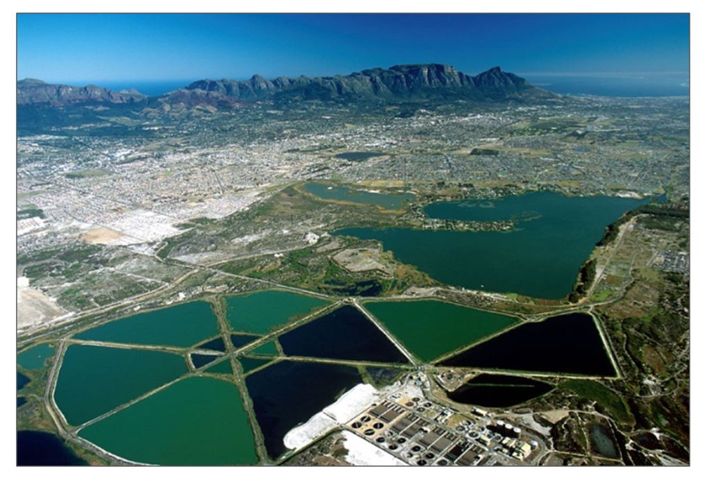 Oblique view of the False Bay Nature Reserve looking north-westwards towards the city. The Strandfontein Birding Area is in the foreground, Zeekoevlei in the middle right and Rondevlei, middle left.